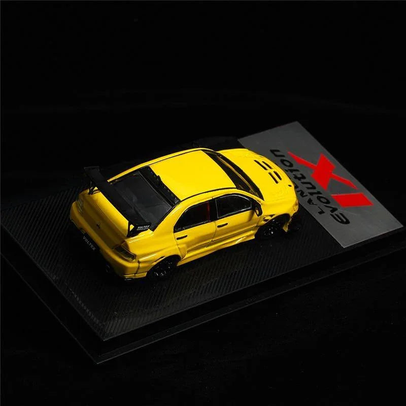 1:64 Voltex Mitsubishi Lancer Evolution IX yellow model car