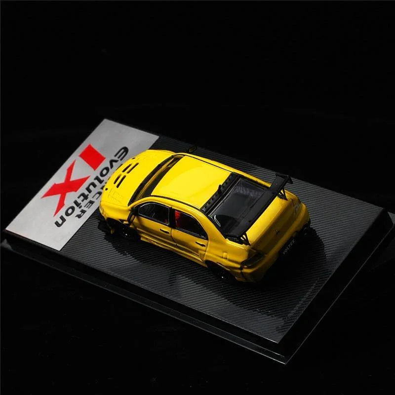 1:64 Voltex Mitsubishi Lancer Evolution IX yellow model car